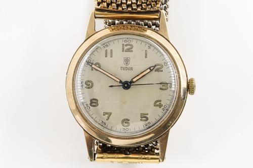 A TUDOR 9CT GOLD, CIRCULAR CASED WRISWATCH