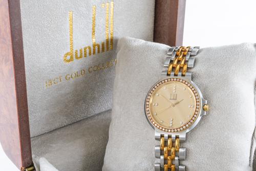 A DUNHILL QUARTZ GENTLEMAN'S GOLD, STEEL AND DIAMOND SET DRESS WRISTWATCH