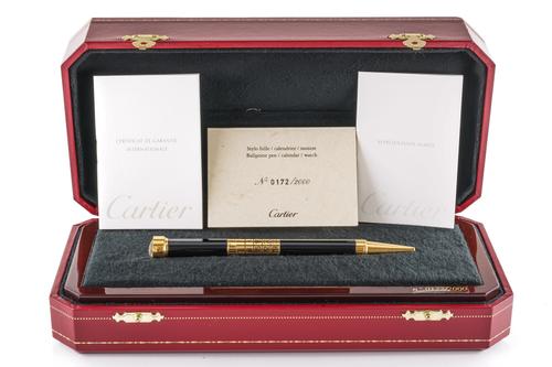 A CARTIER GILT METAL MOUNTED LIMITED EDITION CALENDAR BALL POINT PEN, WITH WATCH