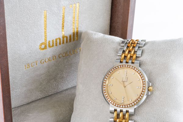 A DUNHILL QUARTZ LADY'S GOLD, STEEL AND DIAMOND SET DRESS WRISTWATCH