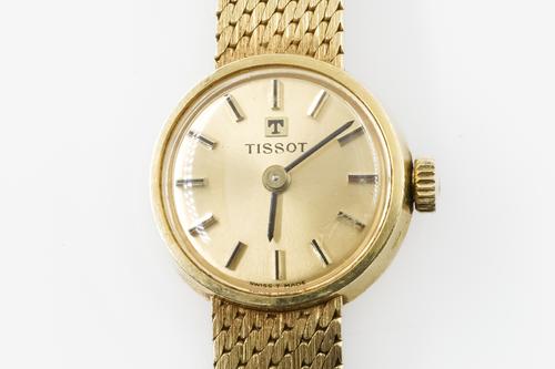 A TISSOT GOLD LADY'S BRACELET WRISTWATCH