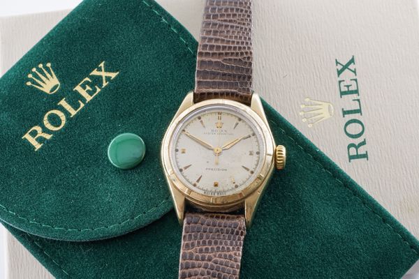 A ROLEX OYSTER PERPETUAL 9CT GOLD CASED GENTLEMAN'S WRISTWATCH