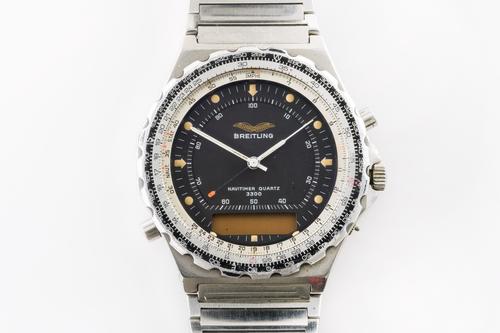 A BREITLING NAVITIMER QUARTZ 3300 GENTLEMAN'S STEEL BRACELET WRISTWATCH