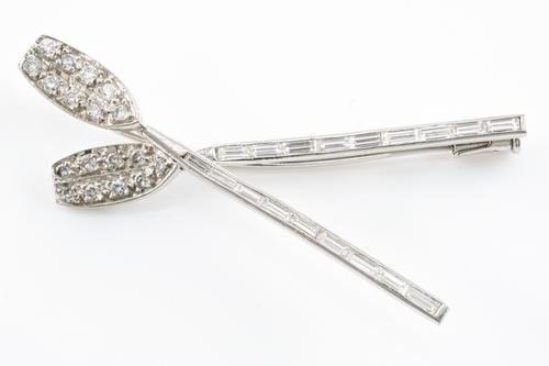 A DIAMOND SET OARS BROOCH