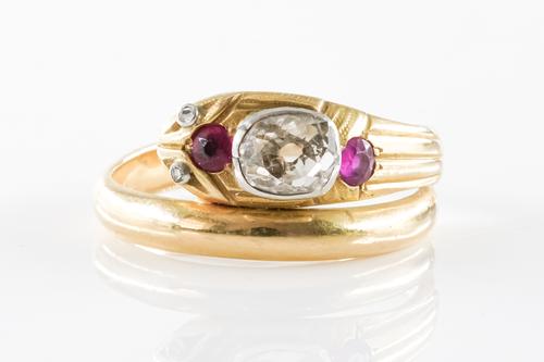 A DIAMOND AND RUBY SNAKE RING
