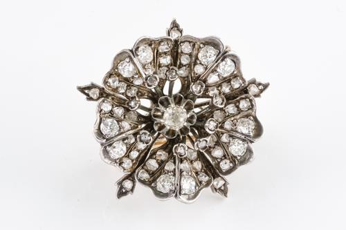 A VICTORIAN DIAMOND SET FLOWER BROOCH