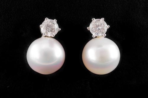 A PAIR OF DIAMOND AND SOUTH SEA PEARL EARRINGS
