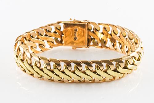 A BI-COLOUR 18CT GOLD BRACELET