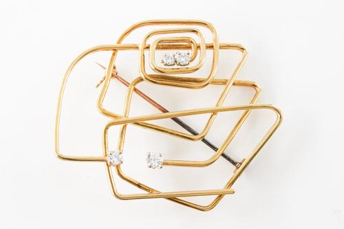 AN ABSTRACT DIAMOND BROOCH