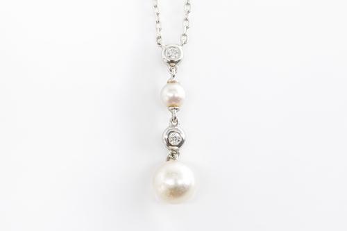 A MIKIMOTO DIAMOND AND CULTURED PEARL PENDANT