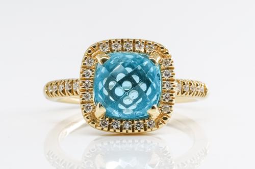 A BLUE TOPAZ AND DIAMOND RING