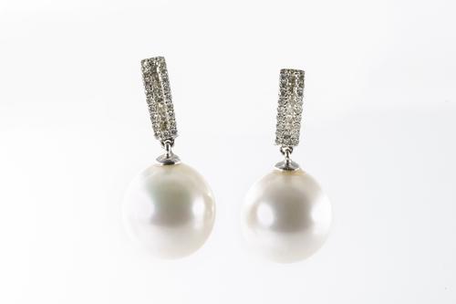 A PAIR OF DIAMOND AND SOUTH SEA DROP EARRINGS