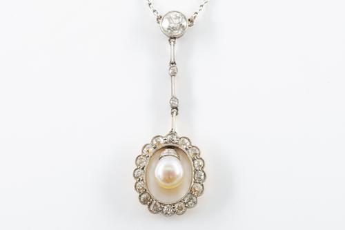 A BELLE EPOQUE NATURAL PEARL AND DIAMOND DROP PENDANT