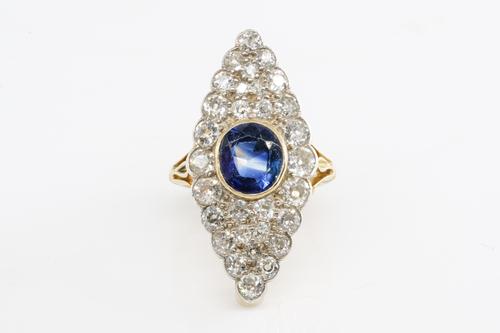 A SAPPHIRE AND DIAMOND MARQUISE SHAPED CLUSTER RING