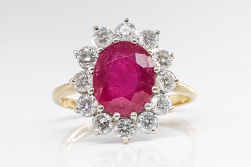 A RUBY AND DIAMOND CLUSTER RING