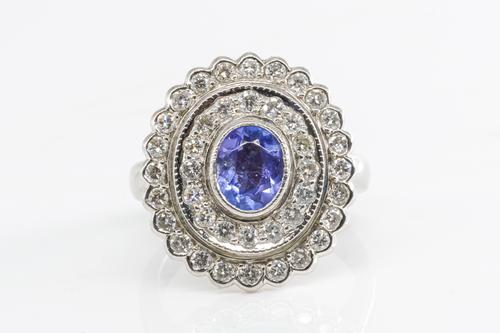 A TANZANITE AND DIAMOND RING