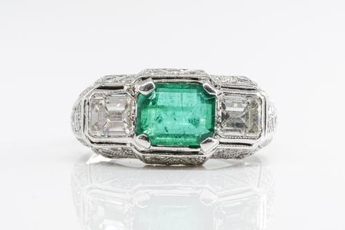 AN EMERALD AND DIAMOND RING