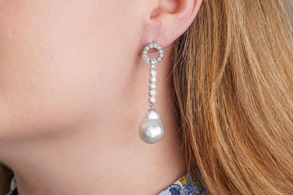 A PAIR OF DIAMOND AND BAROQUE PEARL EARRINGS