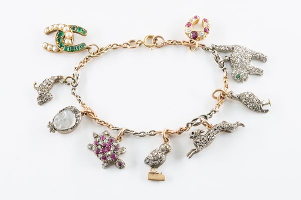 AN ANTIQUE DIAMOND AND GEM SET CHARM BRACELET