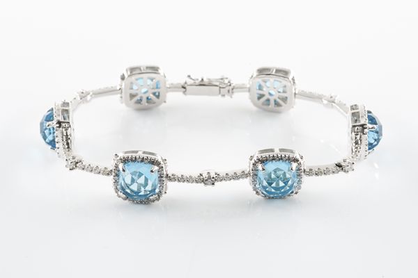 A BLUE TOPAZ AND DIAMOND BRACELET