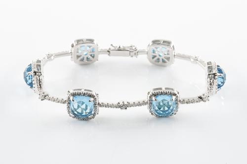 A BLUE TOPAZ AND DIAMOND BRACELET