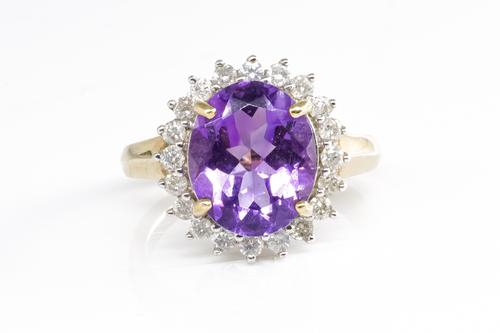 A 9CT GOLD, AMETHYST AND DIAMOND CLUSTER RING