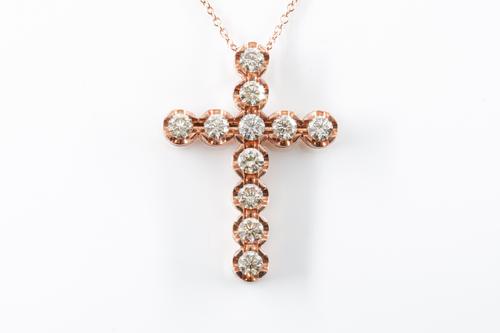 A DIAMOND SET CROSS PENDANT AND CHAIN
