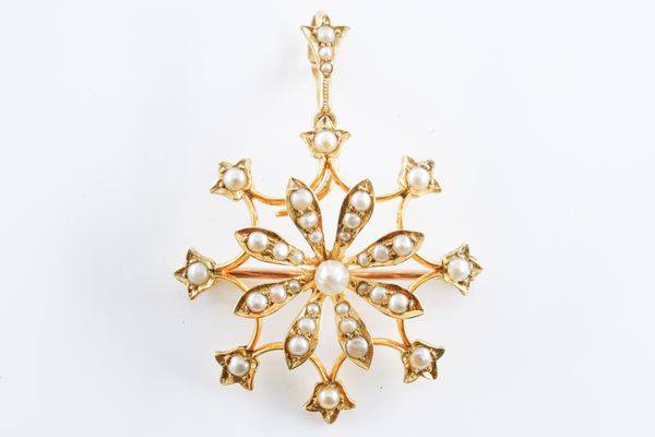 AN EDWARDIAN GOLD AND SEED PEARL SET PENDANT BROOCH