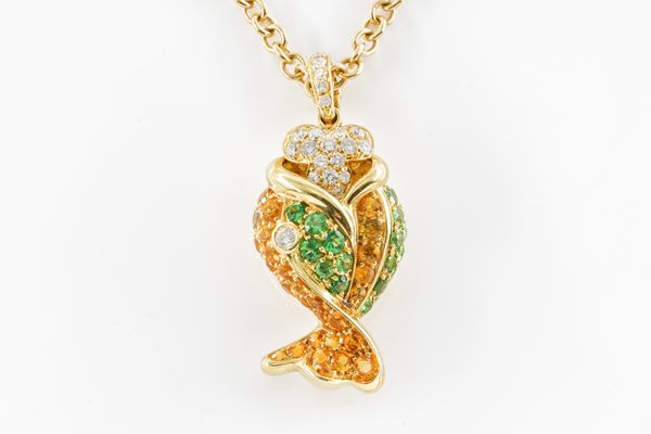 A DIAMOND AND GEMSET FISH PENDANT ON CHAIN