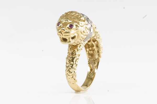 A DIAMOND AND RUBY LION RING