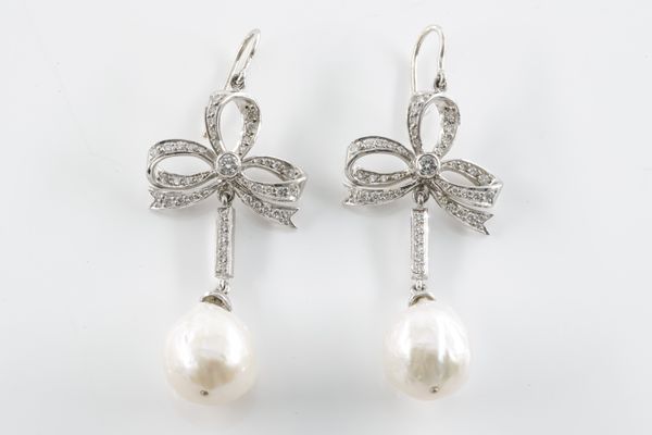 A PAIR OF DIAMOND BOW AND BAROQUE PEARL DROP EARRINGS