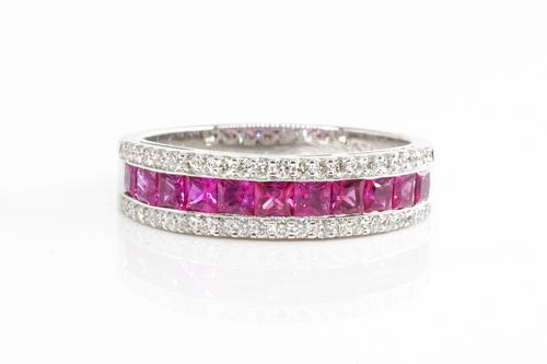 A RUBY AND DIAMOND HALF ETERNITY RING