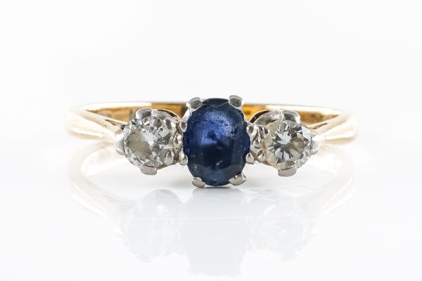 A SAPPHIRE AND DIAMOND THREE STONE RING