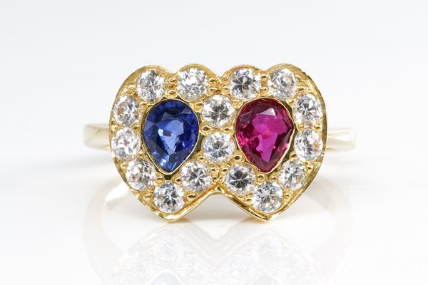 A RUBY AND SAPPHIRE HEART RING