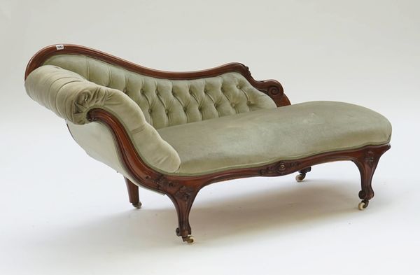 A Victorian mahogany chaise lounge