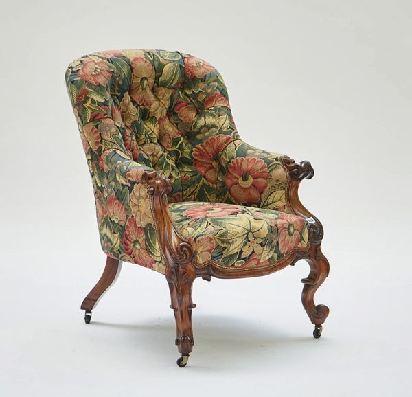 A Victorian rosewood framed tub back easy armchair