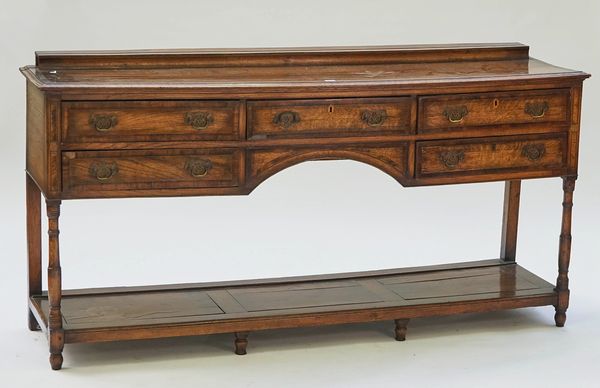 An 18th century style inlaid oak five drawer pot board dresser base