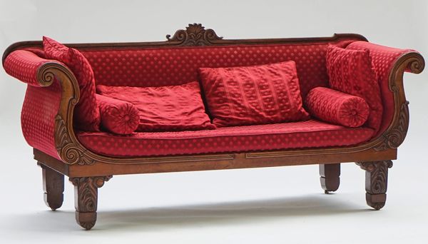 A Regency mahogany framed roll arm sofa