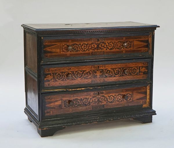 An Italian marquetry inlaid walnut commode