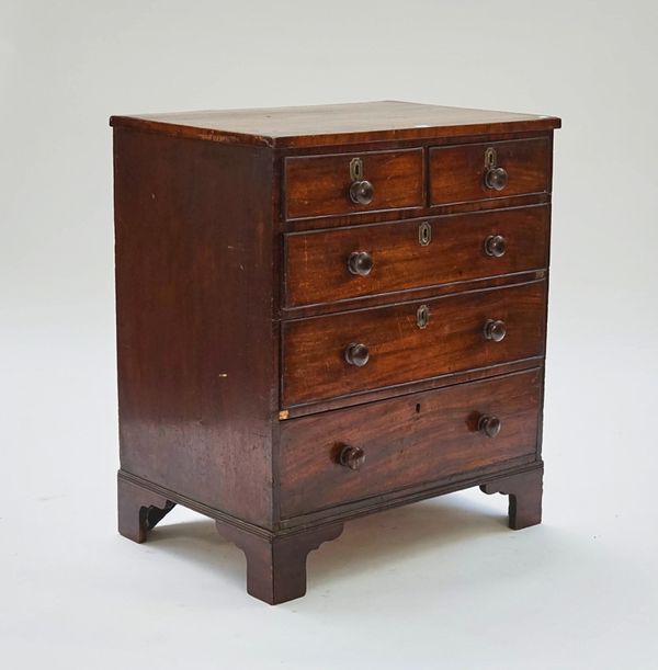 A narrow mahogany chest