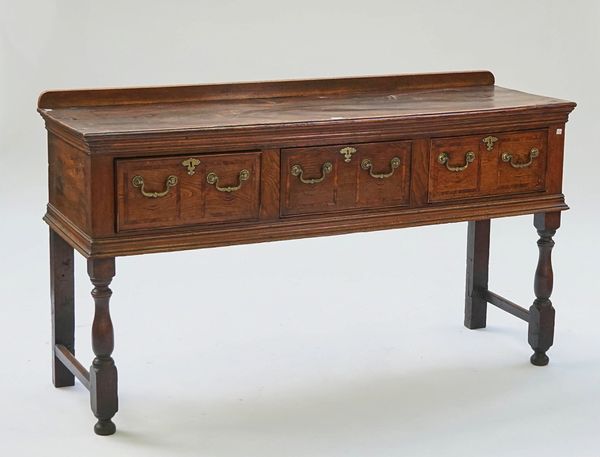 An oak three drawer dresser base