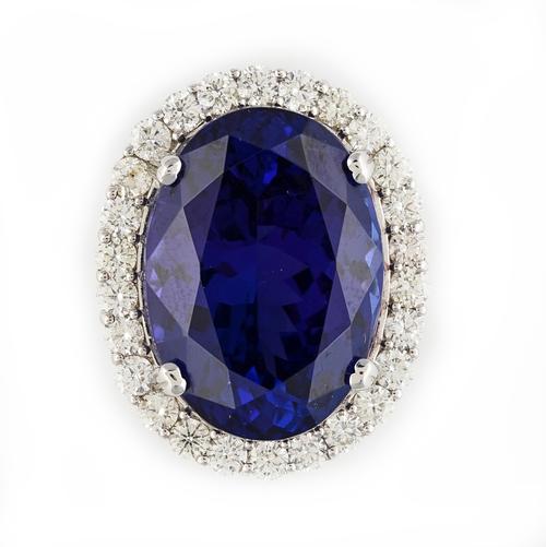 A WHITE GOLD, TANZANITE AND DIAMOND OVAL PENDANT