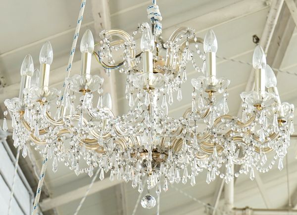 A pair of gilt-metal and glass fourteen light chandeliers