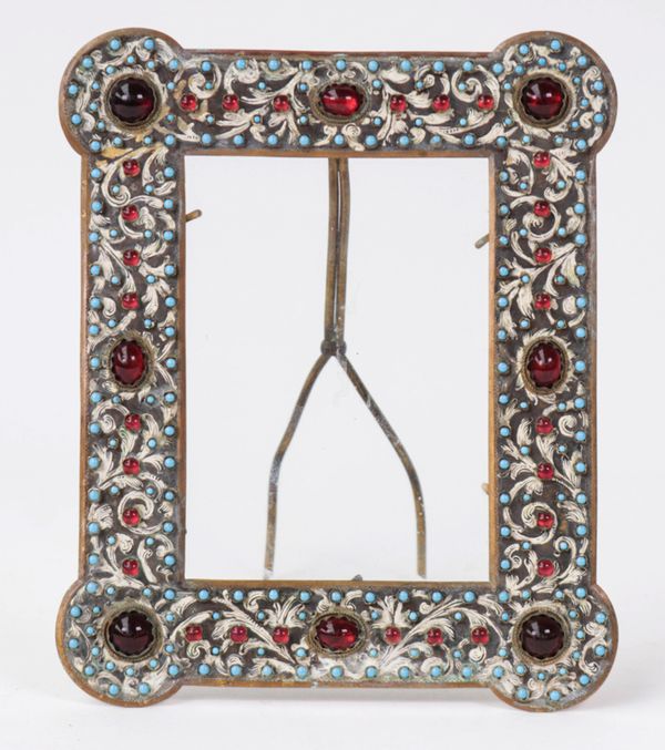 A gilt-metal and cabochon set photograph frame