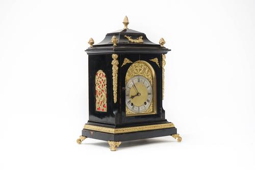 A German gilt-metal mounted ebonised quarter-striking bracket clock