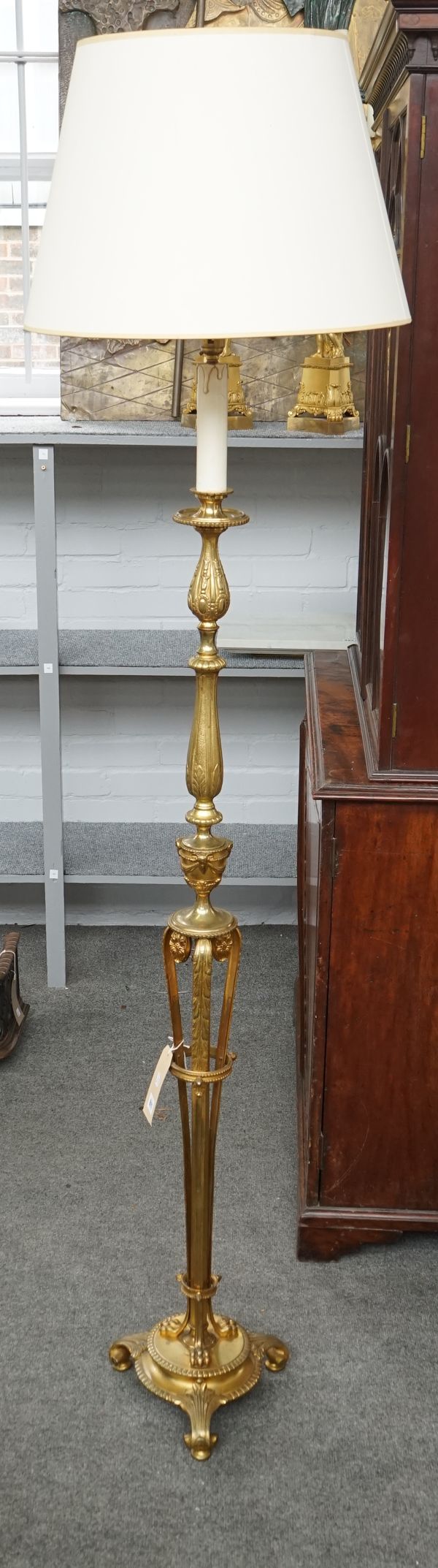 A gilt-metal standard lamp