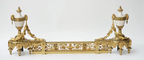 A pair of gilt-metal and white marble chenets