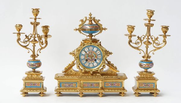 A French gilt-metal and porcelain clock garniture