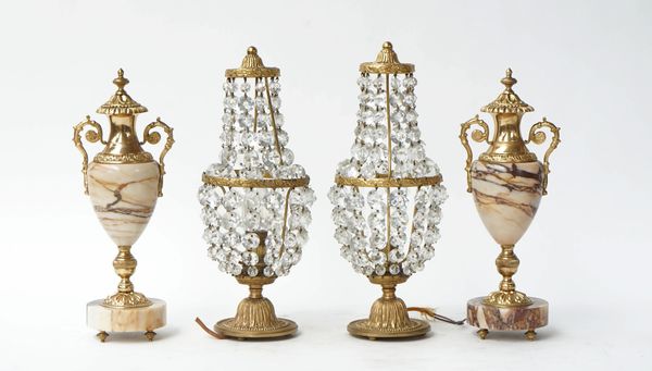 A pair of French gilt-metal mounted marble urns