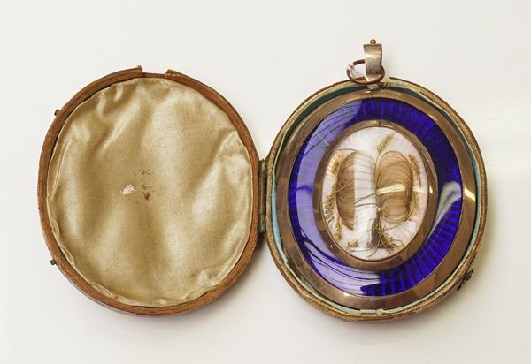 A large George III gold, enamel and hair-work mourning pendant/locket